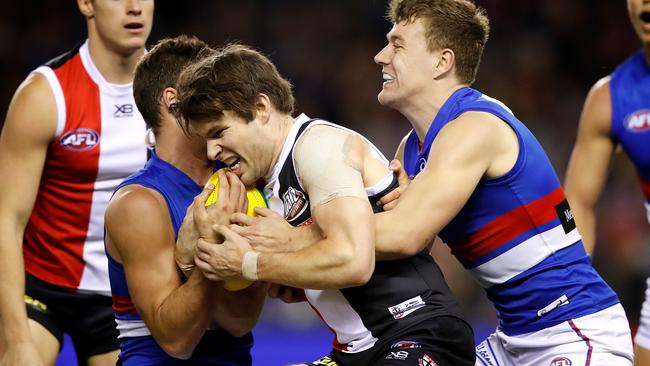 Nathan Freeman is tackled by Josh Dunkley and Jack Macrae.