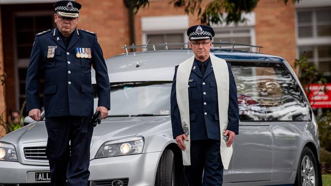 Senior police accompany the hearse carrying Senior Constable Kevin King to the Victoria Police Academy. Picture: Jason Edwards