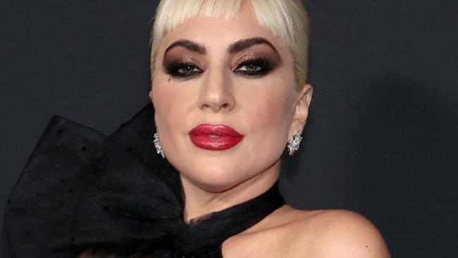 Gaga stuns in braless red carpet look