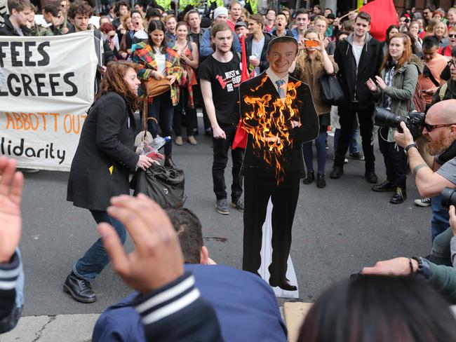 Protest is an important part of university life. Here, a cardboard cut out of former MP Christopher Pyne is set on fire as university students protest against fee changes.