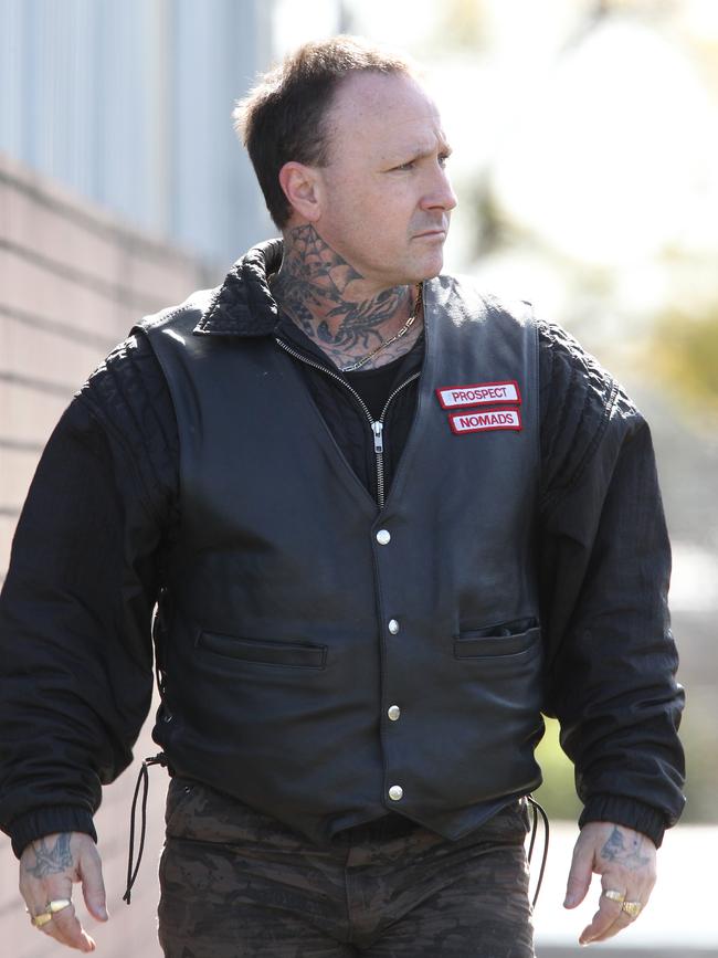 A member of the Nomad bikie gang arrives at the mosque.