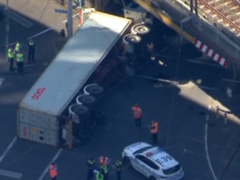 Truck flip sparks CBD traffic chaos