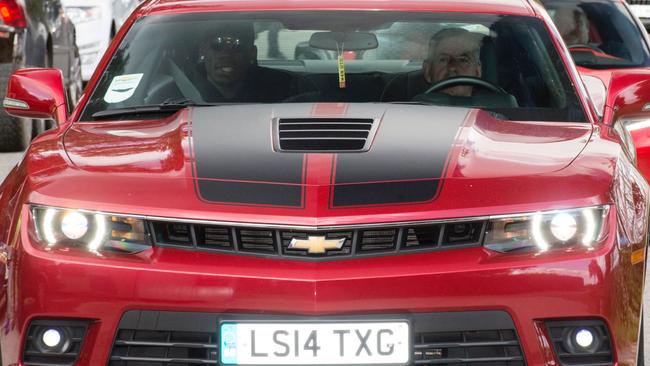 French footballer Paul Pogba (L) arrives in a convoy of vehicles at Manchester United's Carrington training complex, in Manchester, north west England on August 8, 2016. France midfielder Paul Pogba arrived in Manchester on August 8 to complete his record-breaking transfer to Manchester United from Juventus, British media reported. Sky Sports News said the 23-year-old had flown to Manchester from Nice in a private jet and would undergo a medical at United's Training Complex. / AFP PHOTO / OLI SCARFF