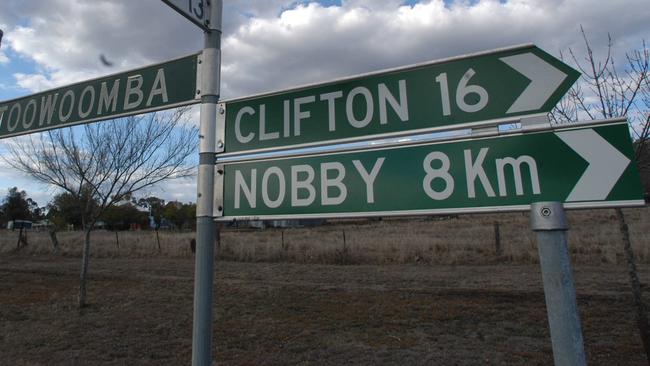 Streets signs on Cambooya Street @ Greenmount indicating the direction and distance to Toowoomba, Clifton, Nobby and Cambooya in Queensland