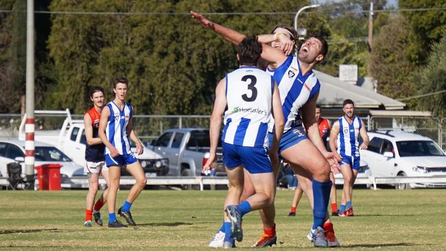 Ouyen United's Mark Jamar entangled in a ruck contest against Mildura in the Sunraysia league. Picture: Michael DiFabrizio