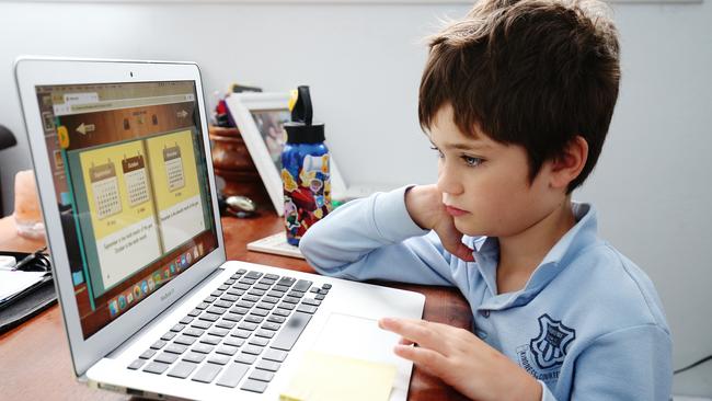 Phoenix Crawford does school work at home in Sydney. Picture: Getty Images