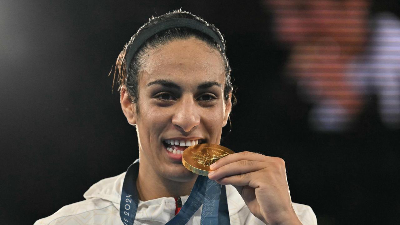 Gold medallist Algeria's Imane Khelif poses on the podium during the medal ceremony for the women's 66kg final boxing category during the Paris 2024 Olympic Games. (Photo by MOHD RASFAN / AFP)