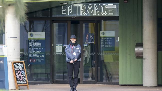 A security guard outside the safe injecting room at North Richmond community centre, which will have its trial extended by three years. Picture: Wayne Taylor