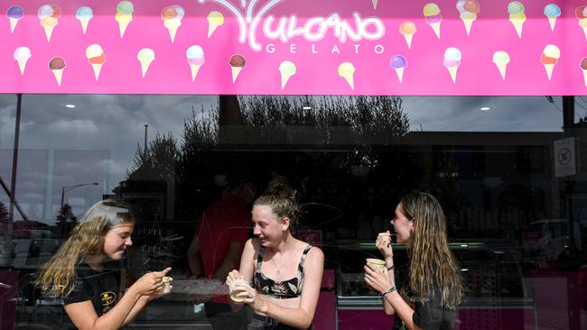 Rye locals Lily, 14, Laine, 14 and Mietta, 13, enjoying a sweet treat. Picture: Penny Stephens