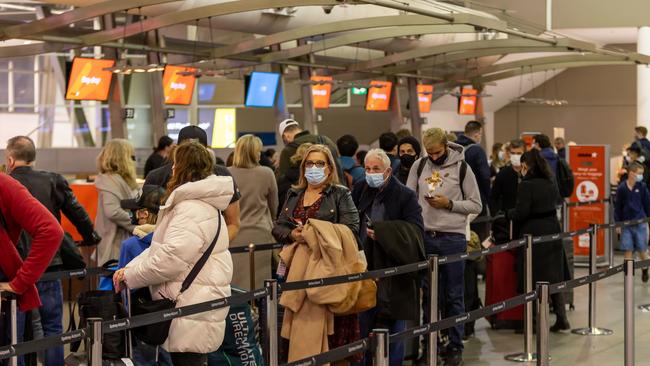 SYDNEY, AUSTRALIA - NewsWire Photos JUNE 09, 2022: Travellers and airport staff are pictured at Sydney International Airport with increased overseas travel causing chaos for DFAT in processing passport applications. Picture: NCA NewsWire / Seb Haggett