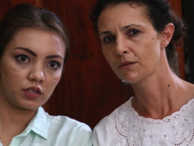 Australian Sara Connor (C) with her translator listen to Gede Suartama a motorbike driver that giving evidence during the trial at Denpasar District Court. Sara and her boyfriend David Taylor accused on murdering Police in Kuta on last August.