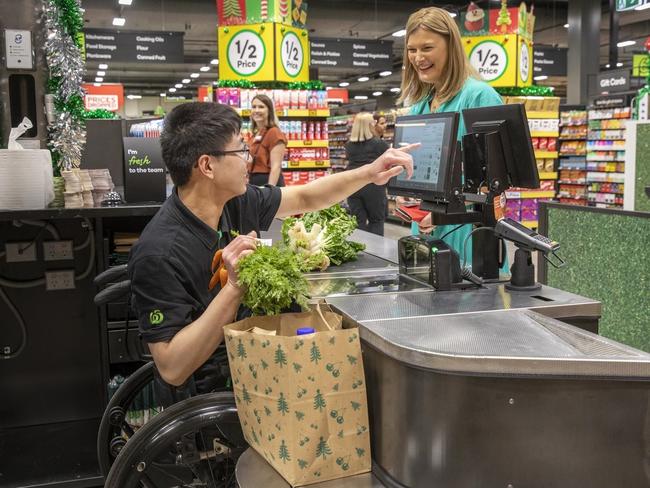 Mr Chen says he’s still getting the hang of scanning vegetables. Picture: Dallas Kilponen/Woolworths