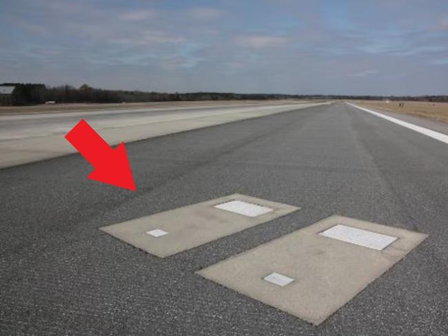 red arrow on runway graves