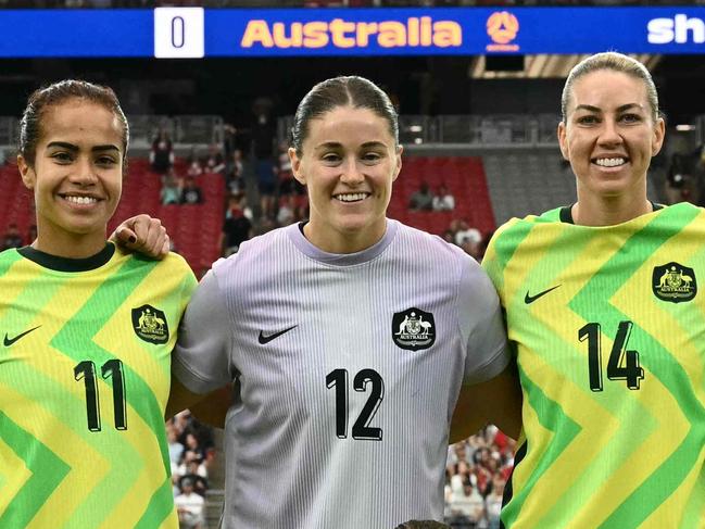 Australia's starting lineup poses for a photo during the SheBelieves Cup football match between USA and Australia at State Farm Stadium in Glendale, Arizona, on February 23, 2025. (Photo by Patrick T. Fallon / AFP)