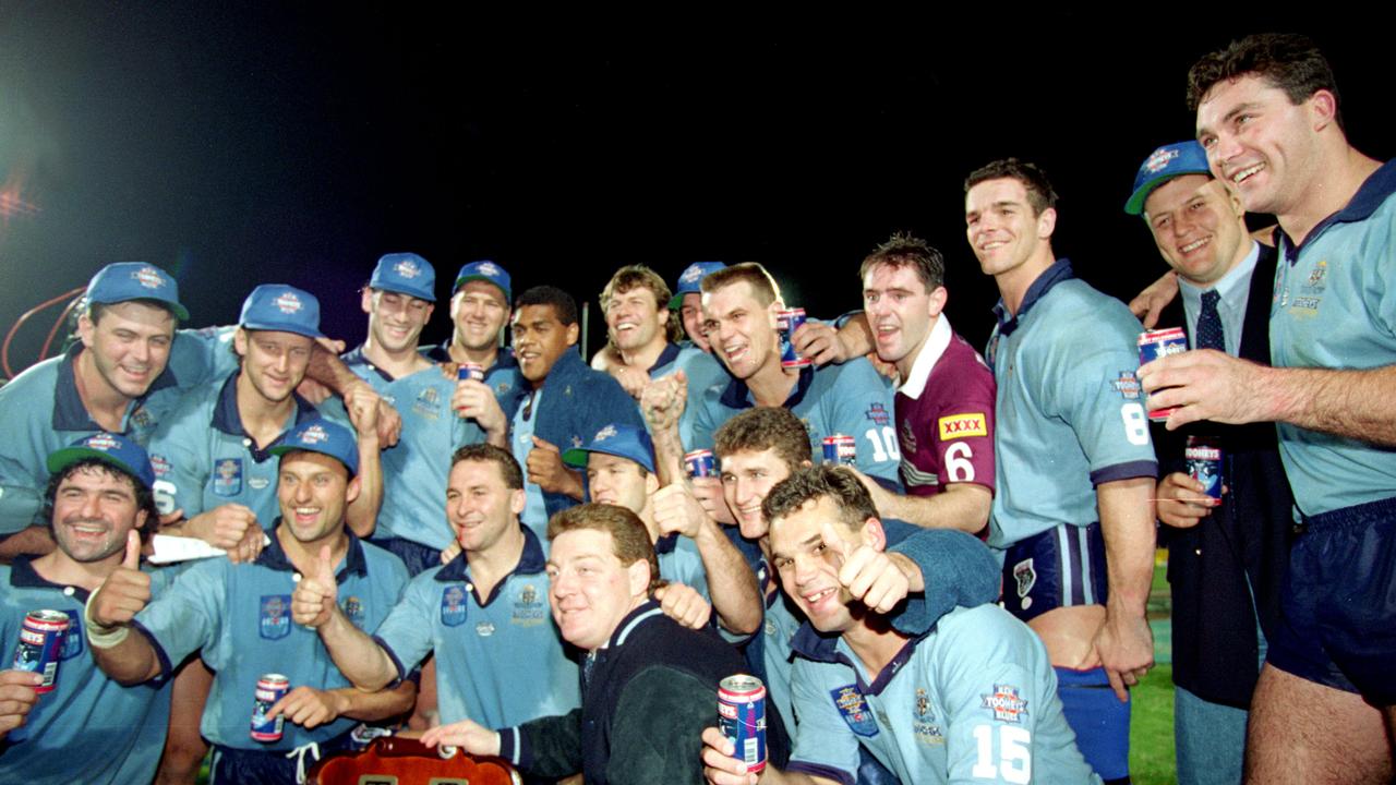 BRISBANE, AUSTRALIA - JUNE 20: The NSW Blues celebrate after winning game three and the series 2-1 after the ARL State of Origin match between the Queensland Maroons and the New South Wales Blues at Lang Park June 20, 1994 in Brisbane, Australia. (Photo by Getty Images)