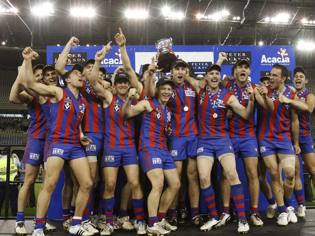 Port Melbourne players with the premiership cup after the 2011 grand final.