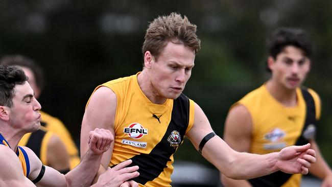 Balwyn’s Jayme Gottliebsen gets a kick away under pressure. Picture: Andy Brownbill