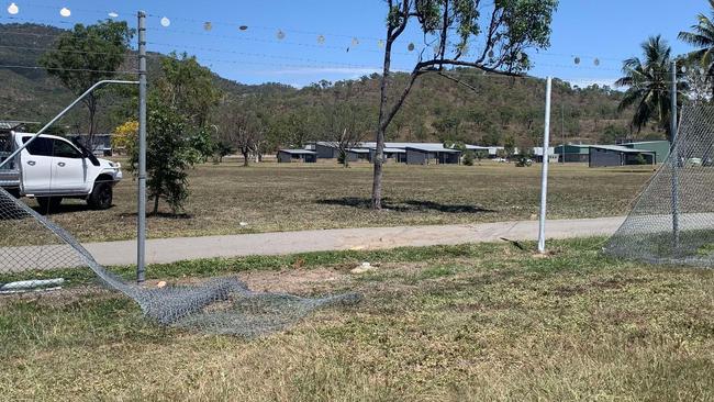 A woman has been hospitalised after her vehicle crashed through the fence at Lavarack Barracks following a three-car collision on University Road, Murray. Photo: Jami Roberts.