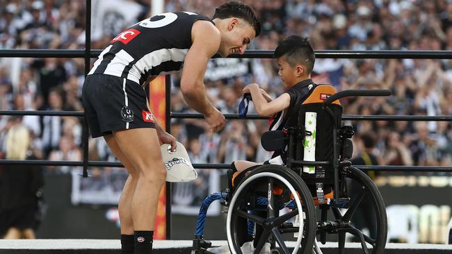 Nick Daicos receives his medal from James Nguyen. Picture by Michael Klein