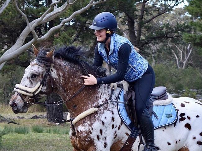 Chelsea Johnson wears an outfit from the Equestrian Rider Apparel Blue Marble collection.