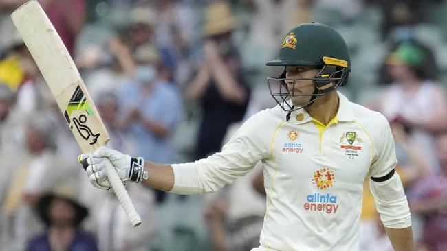 Alex Carey raises his bat after posting his maiden Test half century. Picture: Daniel Kalisz/Getty Images