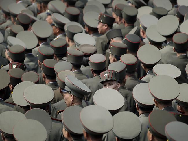 A soldier looks back at the parade square as others look toward their leader Kim Jong Un during a military parade on Saturday, April 15, 2017, in Pyongyang, North Korea. Picture Wong Maye-E