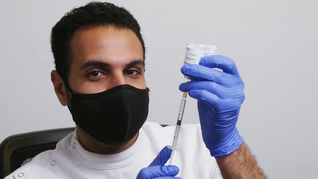 Calanna Pharmacy’s Mo Elliessy prepares a syringe with a vial of the Covid-19 vaccine. Picture: Brendan Radke