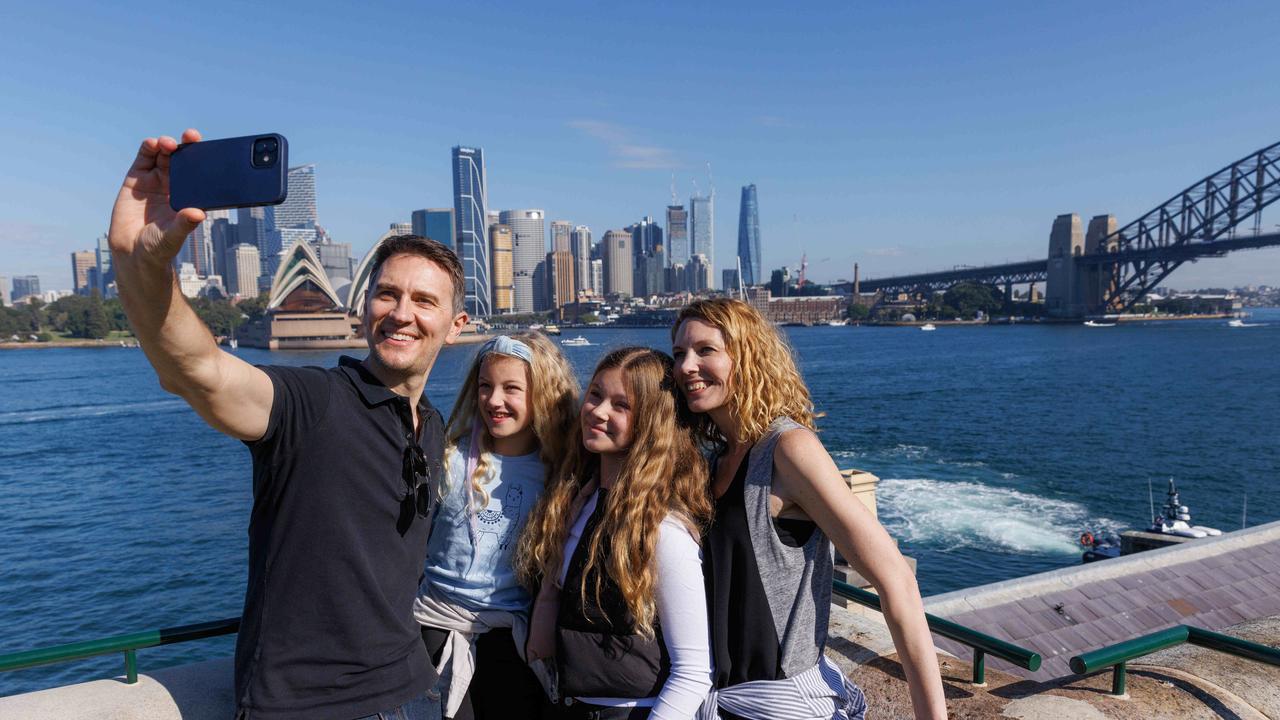 Dan and Fiona Johnson with their kids Ava, 13 and Elena 8 taking in the sights of Sydney Harbour from Kirribilli House. Picture: NCA NewsWire / David Swift