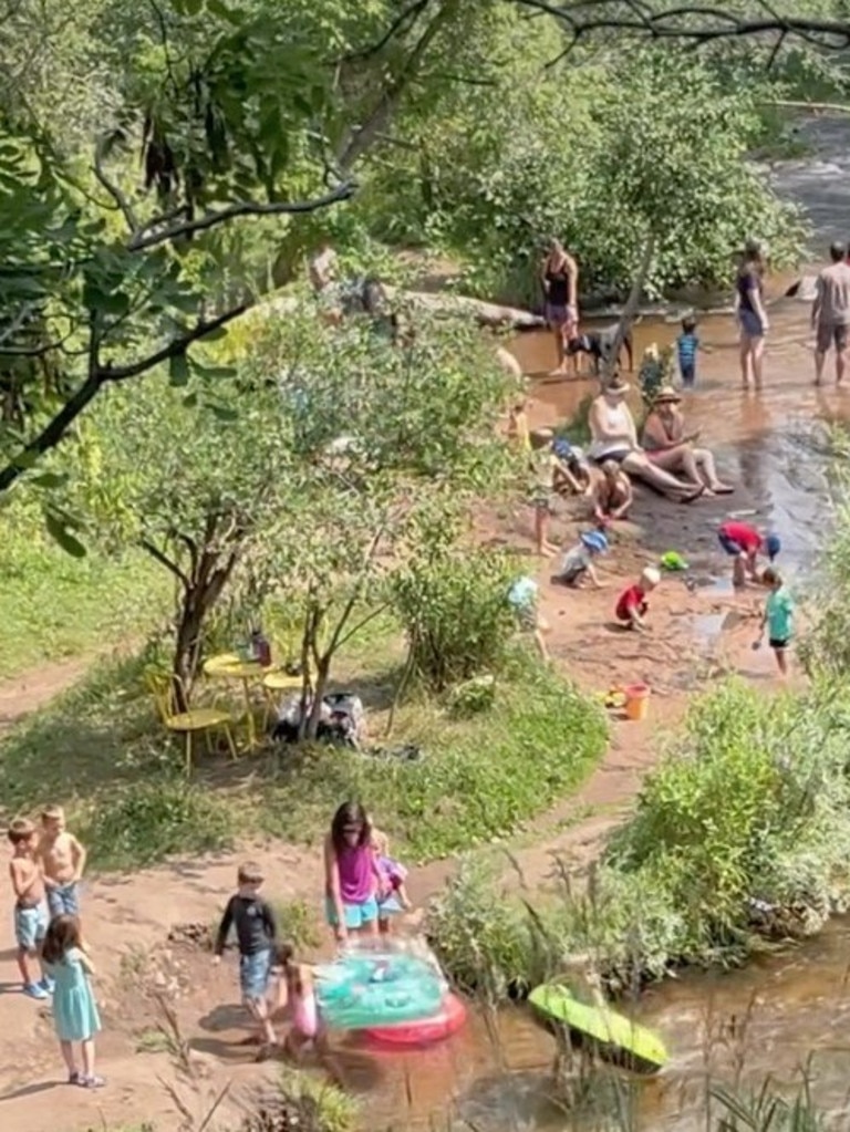 A crowd gathered at the creek in Romero’s back yard. Pictures: Tiktok / wickedwitch_ofthe_west