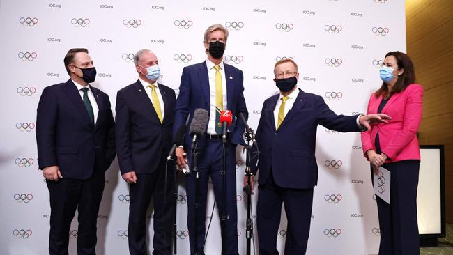 From left, Lord Mayor of Brisbane Adrian Schrinner, Australian Senator Richard Colbeck, three time Olympic gold medalist James Tomkins, President of Australian Olympic Committee John Coates, and Premier of Queensland Annastacia Palaszczuk in Tokyo on July 21. Picture: AFP