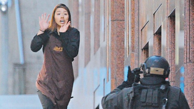 Elly Chen runs from the Lindt Cafe. Picture: AAP Image/Joel Carrett