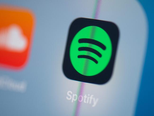 (FILES) In this file illustration photo taken on July 24, 2019 in Paris shows the logo of the Swedish music streaming application Spotify on the screen of a tablet. - Spotify on March 8, 2023 introduced new tools for artists and songwriters, with a particular focus on video formats that are seen as increasingly essential as the world's biggest audio streaming service struggles to break even. (Photo by Martin BUREAU / AFP)