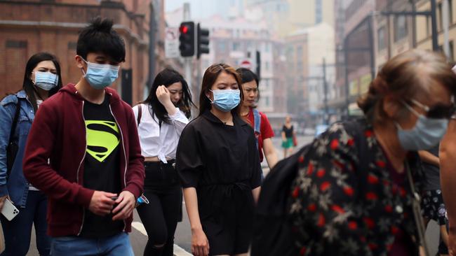 Pedestrians are seen wearing masks in the Sydney CBD. Picture: AAP