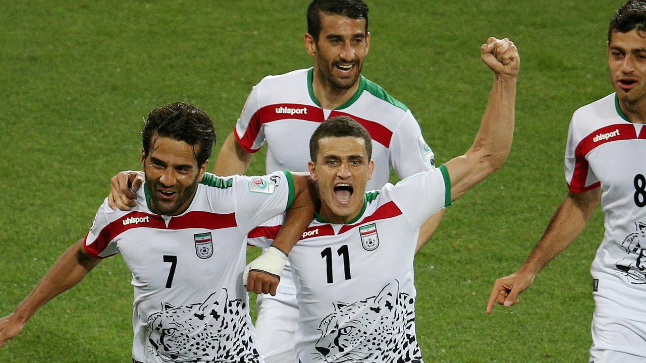 Masoud Shojaei of Iran celebrates a goal with Vorya Ghafouri against Australia: George Salpigtidis.