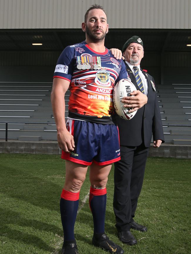 Runaway Bay Rugby League Club stalwart Jimmy Poland with his dad Jim Poland, an army veteran (8/9 RAR Infantry). Picture Glenn Hampson