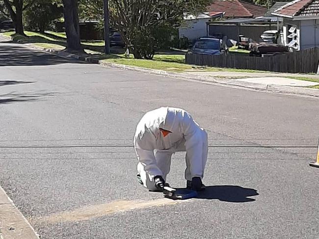 A firefighter from NSW Fire &amp; Rescue's Forestville Brigade removes the last of the dangerous asbestos. Picture: NSW Fire &amp; Rescue