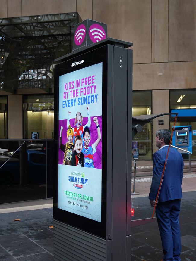 A Telstra phone booth on Collins Street, Melbourne. Picture: AAP Image/Stefan Postles