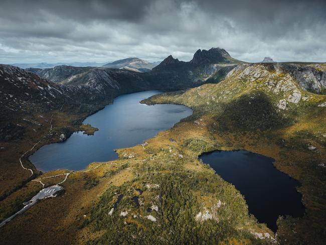 embargo for twam 28 nov 2020 fee appliesCradle Mountain forms the northern end of the wild Cradle Mt - Lake St Clair National Park, itself a part of the Tasmanian Wilderness World Heritage Area. The jagged contours of Cradle Mountain epitomise the feel of a wild landscape, while ancient rainforest and alpine heathlands, buttongrass and stands of colourful deciduous beech provide a range of environments to explore. CR TOURISM TASMANIA