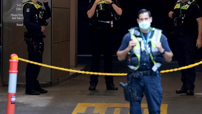 Police outside the Holiday Inn in Melbourne, one of the hotel’s involved in quarantine. Picture: NCA NewsWire / Andrew Henshaw