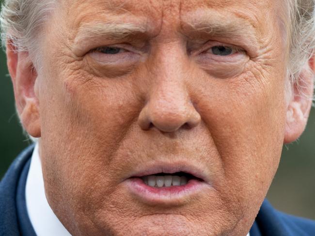 US President Donald Trump speaks to the media as he walks to Marine One prior to departing from the South Lawn of the White House in Washington, DC, October 27, 2020, as he travels on a 3-day campaign trip. (Photo by SAUL LOEB / AFP)