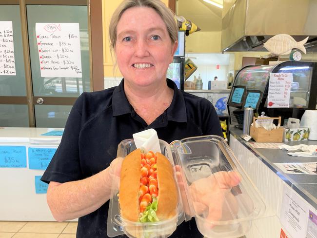 The Prawn Stop owner Melissa Wiles with her popular $7.50 prawn roll. The lunch is a smash-hit for Burdekin workers and travellers.