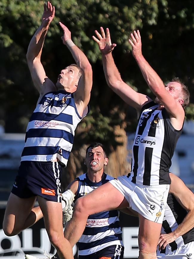 Former Yarrawonga coach Mark Whiley and Wangaratta’s Michael Newton fly for a mark. Picture: Yuri Kouzmin