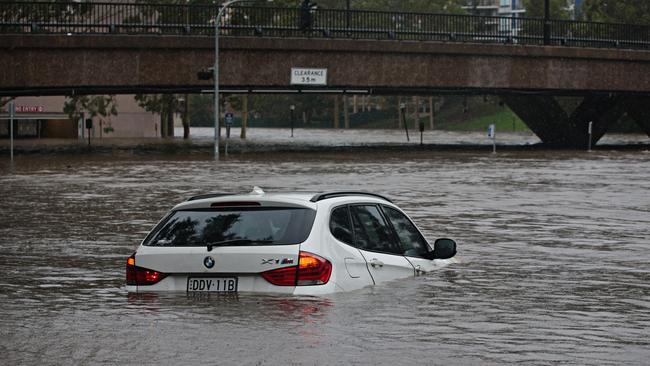 A car sucked into Parramatta River as it was flooding on the February 9. Picture: Adam Yip