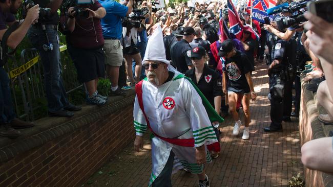 Members of the Ku Klux Klan arrive for a rally, calling for the protection of Southern Confederate monuments, in Charlottesville, Virginia. pecifically excluded white extremists from his “fine people” observation. Picture: AFP