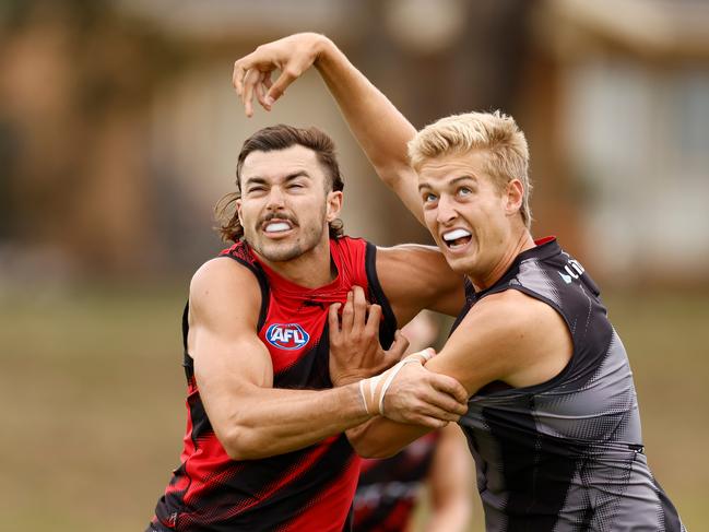 Sam Draper and Nick Bryan wrestle in the ruck at Essendon pre-season training. Picture: Michael Willson/AFL Photos via Getty Images.