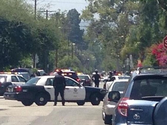 North Hollywood siege ... The scene outside the police cordon near where the gunman was seen on the roof of a house. Picture: Fox 11 news