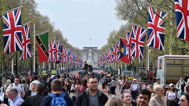 People walk along The Mall, towards Buckingham Palace, ahead of the coronation ceremony of Charles III and his wife, Camilla. Picture: AFP