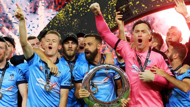 Sydney FC raise the Trophy after winning on penalties during  the A League Grand Final, Sydney FC v Melbourne Victory at Allianz Stadium, Sydney. pic Mark Evans