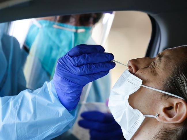 SYDNEY, AUSTRALIA - NewsWire Photos JULY 06, 2021: Alessia Mezzanoppe amd her mum Connie are seen getting a Covid -19 test at the Fairfield Showground Drive through Covid-19 testing clinic during week 2 of the lockdown in Sydney Australia. Picture: NCA NewsWire / Gaye Gerard