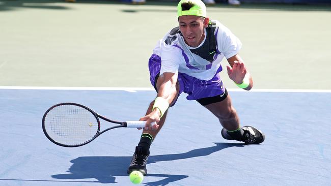 Alexei Popyrin gets down to a low one. Picture: Getty Images